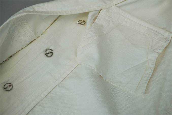 A close up of a white shirt

Description automatically generated with low confidence