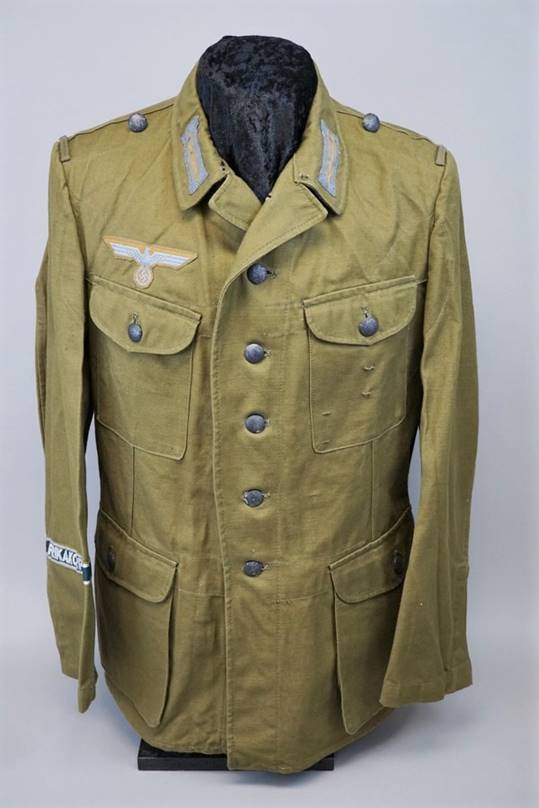 A picture containing clothing, jacket, military uniform, coat

Description automatically generated