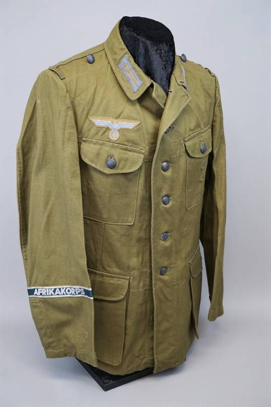 A picture containing clothing, military uniform, jacket, coat

Description automatically generated
