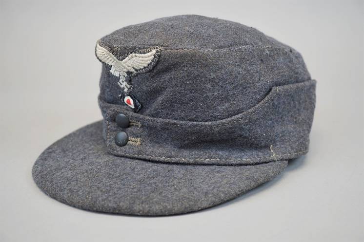 A picture containing hat, headdress, gray

Description automatically generated