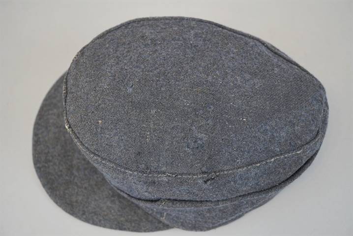 A picture containing wall, indoor, hat, stone

Description automatically generated