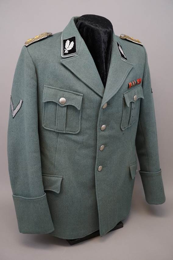 A military uniform on a white background

Description automatically generated with low confidence