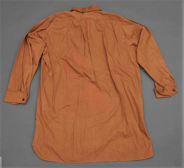 A brown shirt on a blue background

Description automatically generated with low confidence