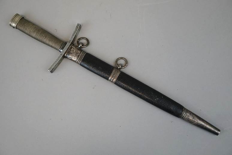 A close-up of a sword

Description automatically generated with low confidence