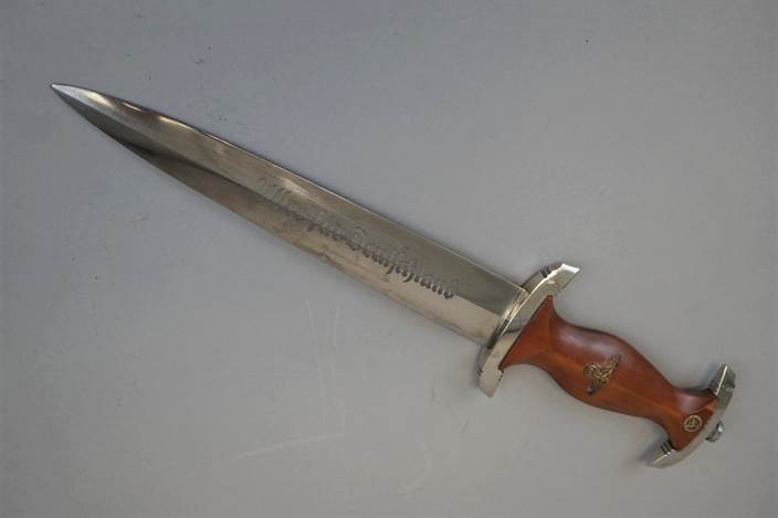 A picture containing weapon, wall, indoor, knife

Description automatically generated