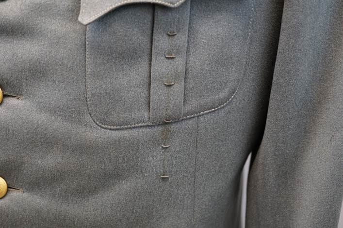 A close up of a person's jacket

Description automatically generated with low confidence