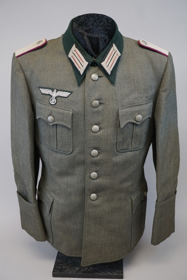 A picture containing clothing, person, suit, military uniform

Description automatically generated