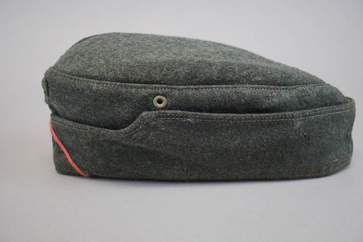 A black hat with a red band

Description automatically generated with low confidence