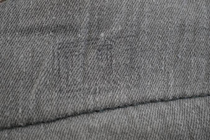 A close up of a grey fabric

Description automatically generated with low confidence