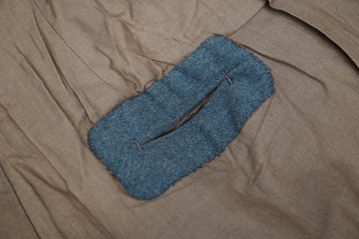 A blue sock on a bed

Description automatically generated with medium confidence