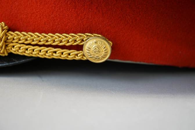 A gold bracelet on a black surface

Description automatically generated with low confidence