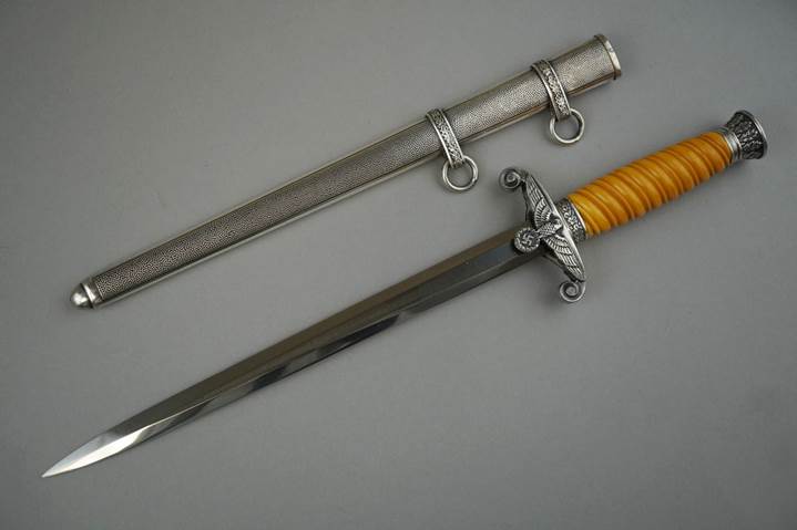 A picture containing weapon, indoor, knife

Description automatically generated
