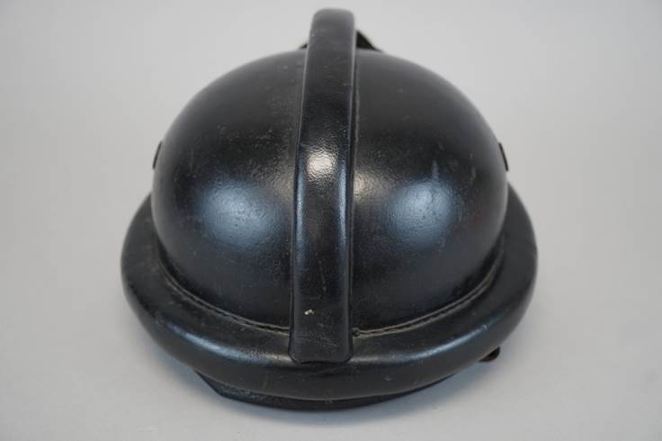 A picture containing headdress, helmet, black, silver

Description automatically generated