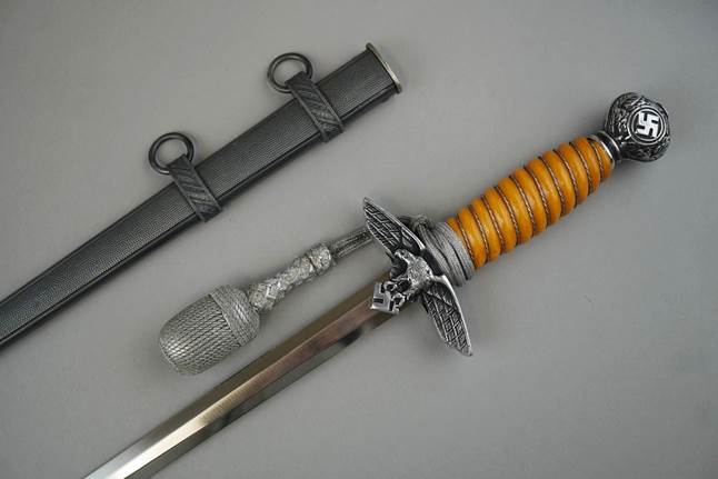 A close-up of a dagger

Description automatically generated with low confidence