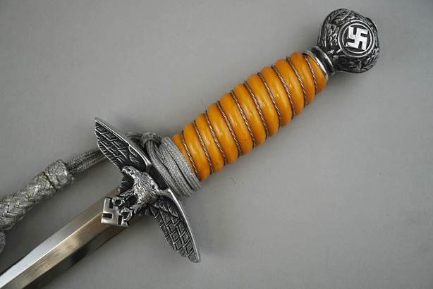 A close-up of a dagger

Description automatically generated with medium confidence