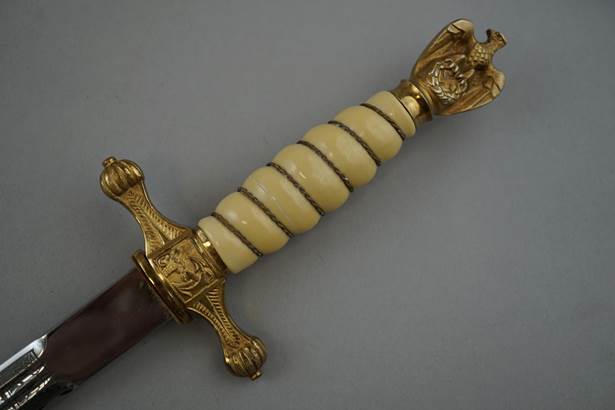 A close-up of a sword

Description automatically generated with medium confidence