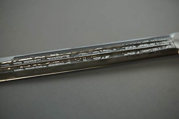 A close-up of a pen

Description automatically generated with medium confidence