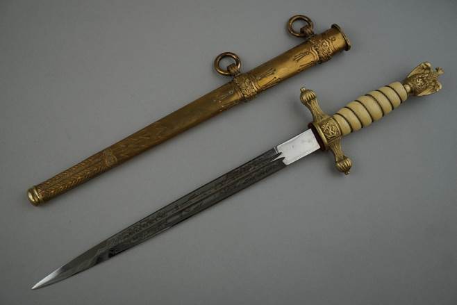 A close-up of a dagger

Description automatically generated with low confidence