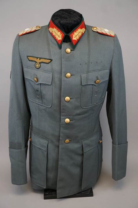 A picture containing clothing, military uniform, coat, collar

Description automatically generated