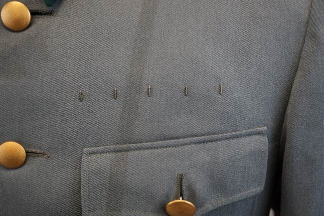 A close-up of a suit pocket

Description automatically generated with medium confidence