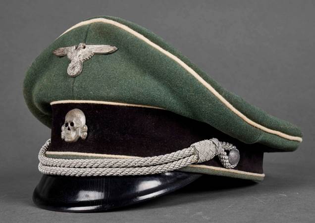 A green military hat with a skull on it

Description automatically generated with low confidence