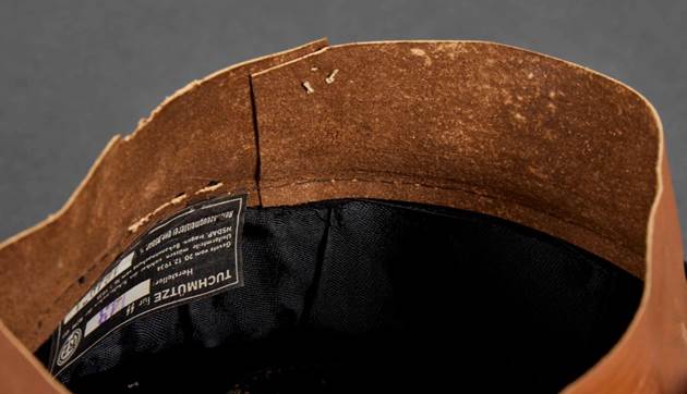 A close-up of a brown hat

Description automatically generated with low confidence