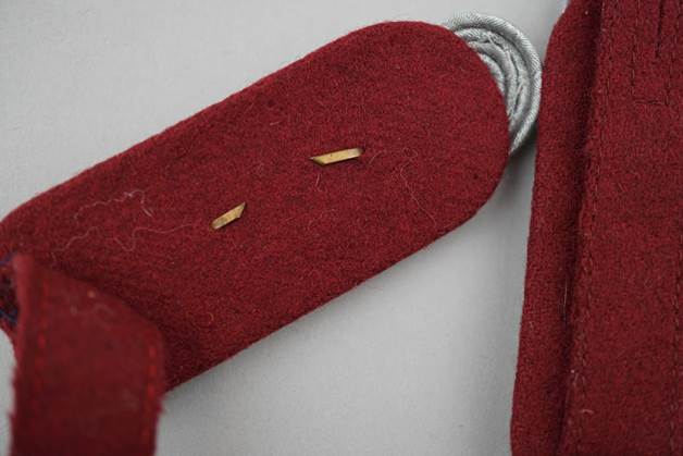 Close-up of a red felt pocket knife

Description automatically generated