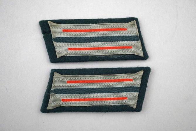 A pair of striped patches

Description automatically generated