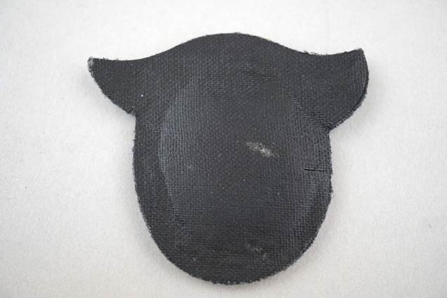 A black patch with ears

Description automatically generated