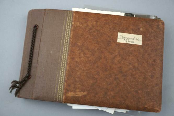 A brown folder with a brown cover

Description automatically generated