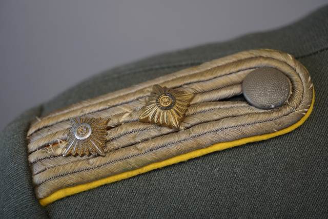 Close-up of a military uniform

Description automatically generated