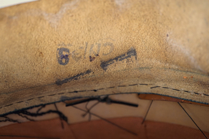 Close-up of a leather shoe

Description automatically generated