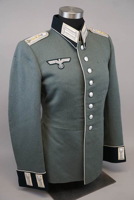 A grey military uniform with white buttons

Description automatically generated