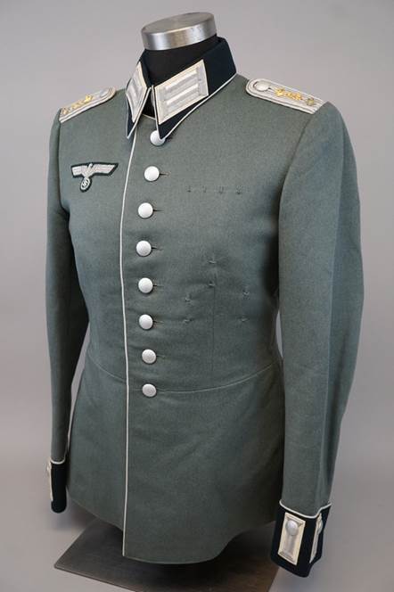 A military uniform on a mannequin

Description automatically generated