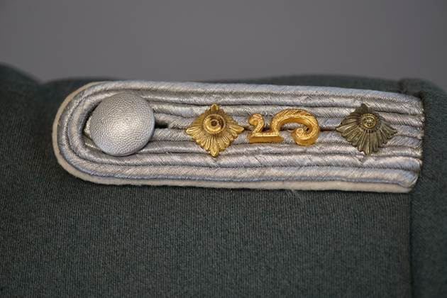 Close-up of a military insignia

Description automatically generated