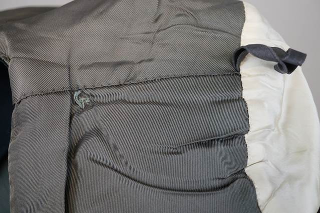 A close up of a grey jacket

Description automatically generated