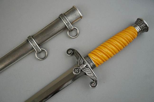 A close-up of a sword

Description automatically generated