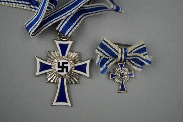 A group of medals with ribbons

Description automatically generated