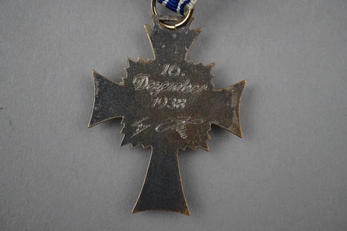 A close-up of a medal

Description automatically generated