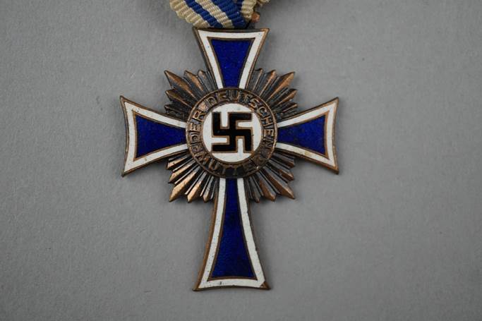 A close-up of a medal

Description automatically generated