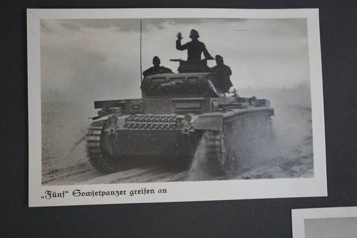 A black and white photo of a tank

Description automatically generated