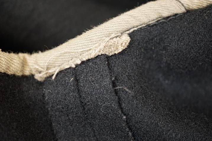 A close-up of a black fabric

Description automatically generated