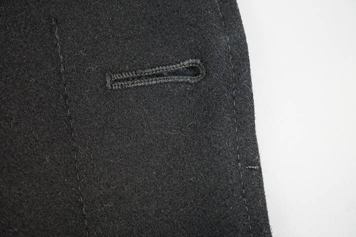 Close-up of a black coat

Description automatically generated