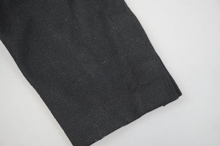 A close-up of a black fabric

Description automatically generated
