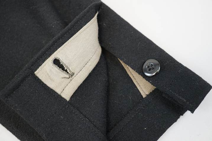 A close-up of a black shirt

Description automatically generated