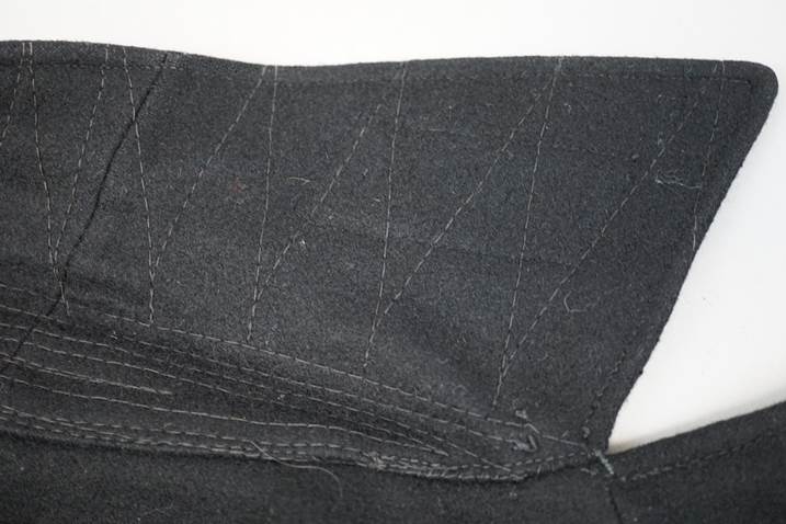 A close-up of a black piece of fabric

Description automatically generated