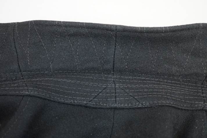Close-up of a black pants

Description automatically generated