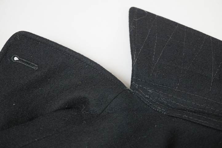 A close-up of a black shirt

Description automatically generated