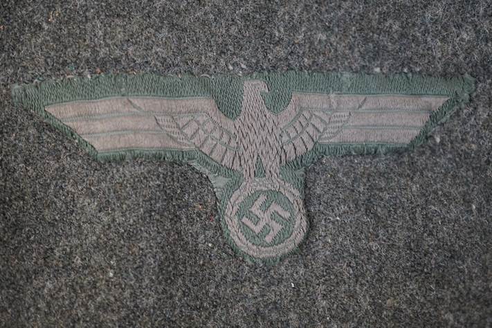 A close-up of a military insignia

Description automatically generated