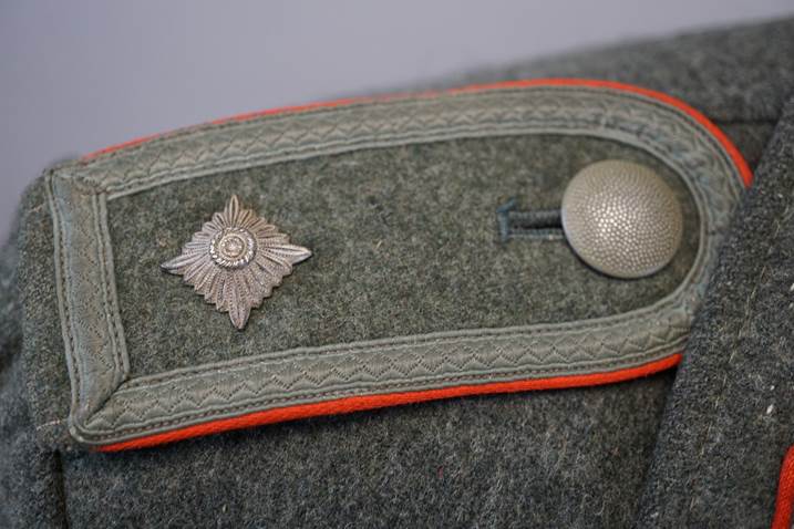 A close-up of a military uniform

Description automatically generated